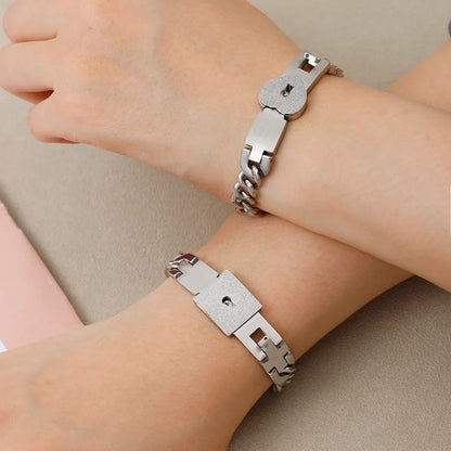 Matching bracelets with a heart-shaped lock 💕